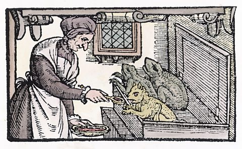 An engraving of a witch feeds her familiars from 1579.