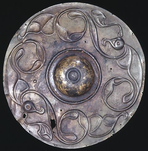The Wandsworth Shield, made of copper alloy and found in Wandsworth, England. The decoration on the shield is two birds with their wings outstretched. On display at the British Museum.