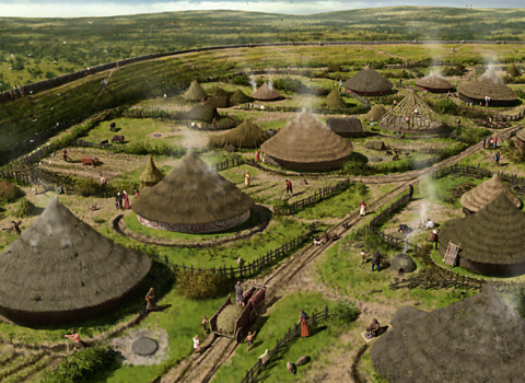 A reconstruction drawing of roundhouses at Maiden Castle in the Iron Age.