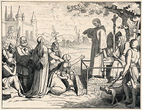 An engraving showing a German witch finder accusing a woman of witchcraft.