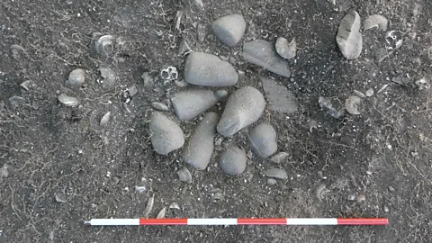 Francesco Genchi/Sapienza University of Rome A ground-breaking find was a small ritual well with 12 polished stone pestles buried inside (Credit: Francesco Genchi/Sapienza University of Rome)