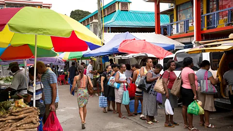 economic images/Alamy Stock Photo Shoppers queue at the Sir Selwyn Selwyn-Clarke Market (Credit: economic images/Alamy Stock Photo)