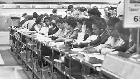 A photograph of black students sitting at the counter in Greensboro