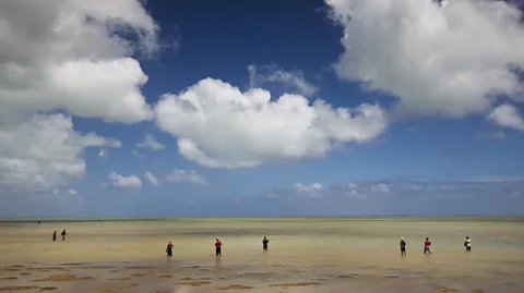 Walter Bibikow/Getty Images The tiny volcanic island is encircled by an aquamarine lagoon, where locals fish for octopus (Credit: Walter Bibikow/Getty Images)