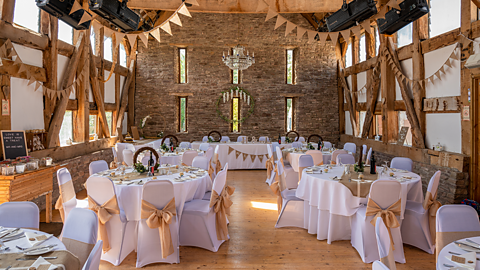 A wedding venue with tables ready for guests.