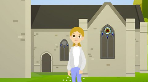 Hannah stands outside a church