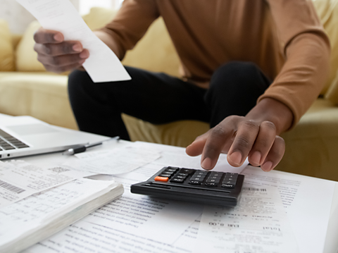 A man using a calculator.