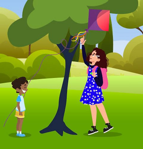 Niamh helping a child by getting a kite out of a tree.