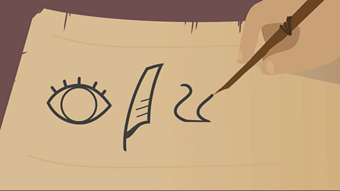 A cartoon of a hand writing symbols on a piece of papyrus. 