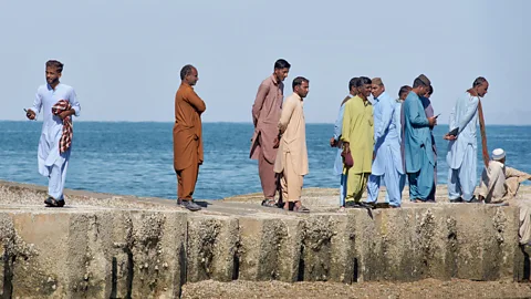 Simon Urwin Sunset-watchers gather at Sunset Point on Jiwani Beach (Credit: Simon Urwin)