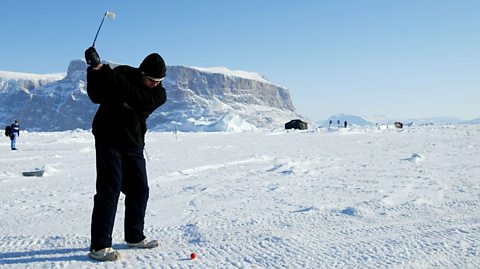 Scottish player Roger Beames takes a shot on the ice at the 2002 World Ice Golf Championships.