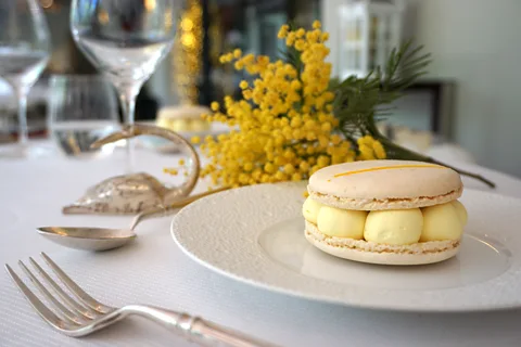 Chrissie McClatchie Mathieu Marchand, executive pastry chef at Riviera institution L'Oasis, created a mimosa-flavoured macaron (Credit: Chrissie McClatchie)