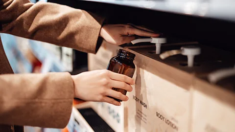 Getty Images The packaging makes a significant contribution to the total emissions from shampoo and shower gel. But refillable bottles can lower these emissions (Credit: Getty Images)