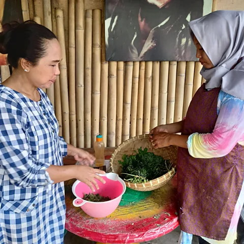 Mark Eveleigh Nafisha Dewi (pictured left), chef at Rasta Café Medewi, uses moringa leaves in many of her dishes (Credit: Mark Eveleigh)