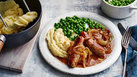 sausage, mash, peas in onion gravy