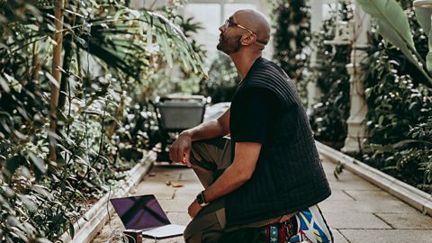 An image of Jason Singh, the nature beatboxer, using his technical equipment to record the electrical signals of plants. 