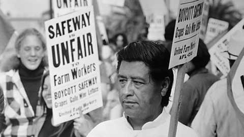 A photograph of Cesar Chavez among a group of protesters