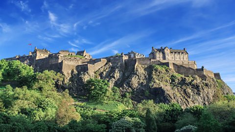 Edinburgh Castle on sunny day with blue sky.