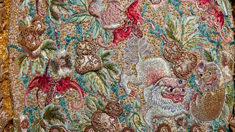 Guo Pei/ Legion of Honor/ Fine Arts Museum, San Francisco Intricate embroidery incorporates motifs drawn from both Chinese Imperial Court and European Baroque traditions (Credit: Guo Pei/ Legion of Honor/ Fine Arts Museum, San Francisco)