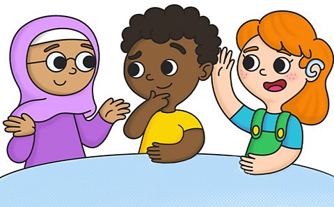 Three children talking round a table