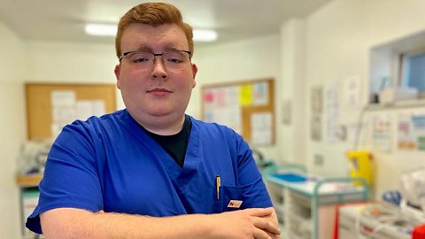 James at work with medical equipment behind him.