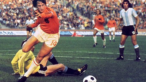 Dutch footballer Johan Cruyff on his way to scoring a goal during the 1974 World Cup.