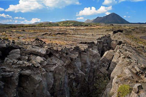 An image of a tectonic rift at a fault line, one plate is slipping beneath the other.