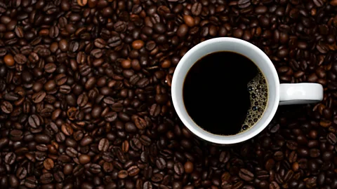 Daniel Kloe/Getty Images Coffee beans and cup of coffee (Credit: Daniel Kloe/Getty Images)