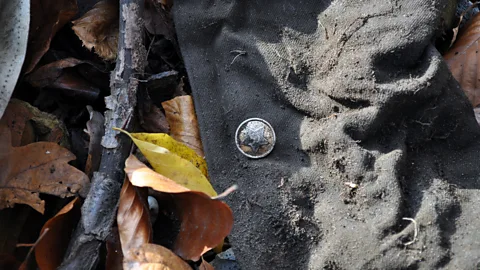 Grzegorz Kiarszys A button on a Soviet uniform. The hammer and sickle insignia is just visible at the centre (Credit: Grzegorz Kiarszys)