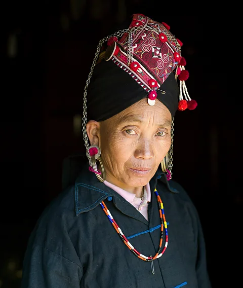 Getty Images The Akha Oma of Phongsali province, Laos, create exquisite traditional dresses and headdresses (Credit: Getty Images)