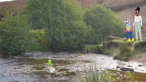 A child and an adult look at a river. 