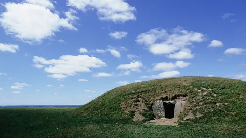 Werner Forman/UIG/Getty Images As human civilisation continued, ornate tombs – like this Irish burial mound – became more common (Credit: Werner Forman/Universal Images Group/Getty Images)