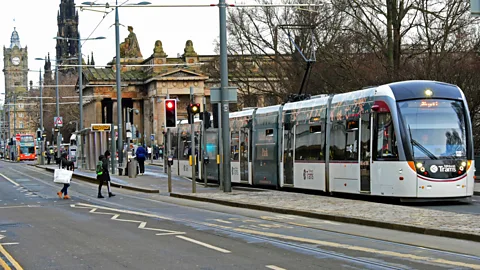 Ken Jack/Getty A roadless world would open up space for electrified public transport, including trams like this one in Edinburgh, Scotland (Credit: Ken Jack/Getty)