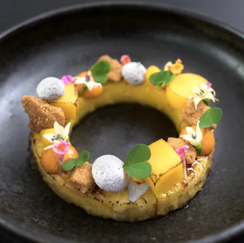 Meza Malonga Mananasi: spice pineapple rings with coconut meringue and ginger caramel (Credit: Meza Malonga)