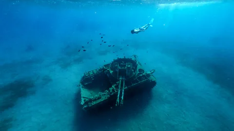 Lepretre Pierre/Getty Images In Aqaba, a sunken military tank has been scuttled to create an artificial reef for marine life (Credit: Lepretre Pierre/Getty Images)