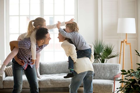 Two children playing with parents.