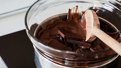 A picture of some pieces of chocolate being tempered.