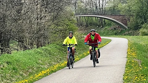 Larry Bleiberg Vennbahn cyclists pedal past medieval towns, nature reserves and misty farm fields (Credit: Larry Bleiberg)