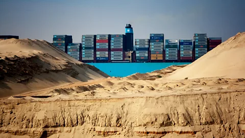 Camille Delbos/Art In All of Us/Getty Images Container ship in Suez Canal (Credit: Camille Delbos/Art In All of Us/Getty Images)