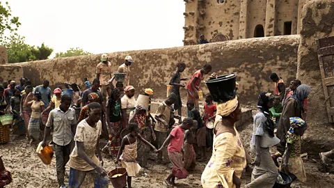 Michele Cattani / Getty Images The annual reclaying of the Great Mosque of Djenné in Mali is considered an important symbol of social cohesion (Credit: Michele Cattani / Getty Images)