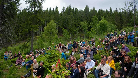Future Library/Jola McDonald Ceremony attendees sit among the growing trees that will provide the paper for the library (Credit: Future Library/Jola McDonald)