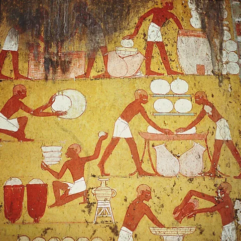 Album/Alamy Hieroglyphics of farmers collecting wheat and baking loaves can be found on tombs and temples in Egypt (Credit: Album/Alamy)