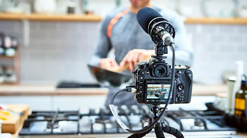 Getty Images Content creators are essentially freelance workers with long hours and inconsistent earnings, contributing to issues like burnout (Credit: Getty Images)