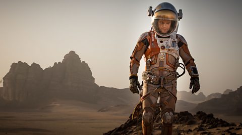 An image of actor Matt Damon dressed as an astronaut as part of the film The Martian.