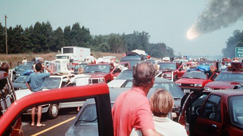 Image of a huge traffic jam with a comet falling in the background. Still from the film Deep Impact.