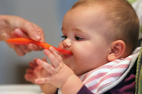 Getty Images Feeding a baby many different foods during their first year of life is thought to help prevent allergies (Credit: Getty Images)