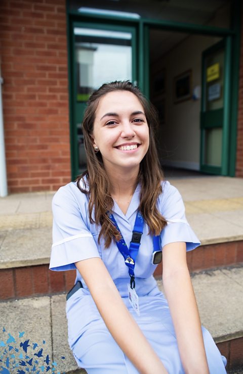 An image of Millie outside the hospital she had her placement at. 