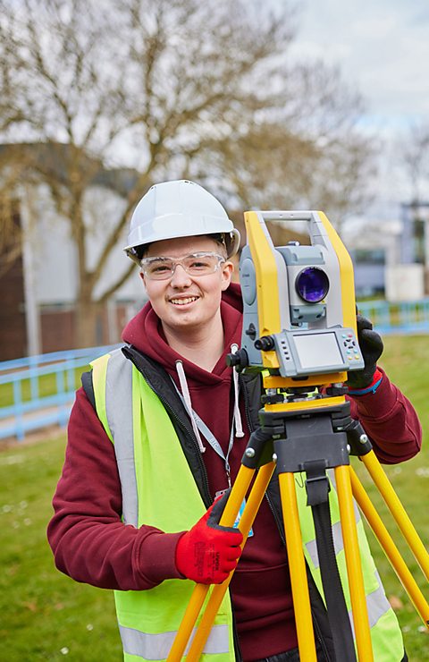 An image of Rares, the T-level student with a high viz jacket and hardhat on. 