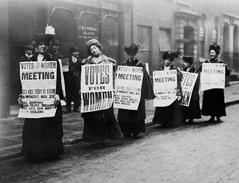 Contemporary photograph of suffragettes with placards protesting in London as part of the campaign to win women the right to vote, 1912.