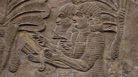 Alamy A relief of scribes taking notes in ancient Nineveh (Credit: Alamy)